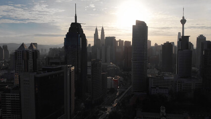 Fototapeta premium Aerial view of the silhouette of skyscrapers and the city center of Kuala Lumpur.