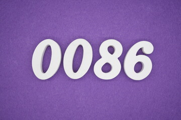 The numbers are made of white paint wood, placed on the background as a purple paper.