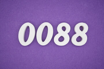The numbers are made of white paint wood, placed on the background as a purple paper.