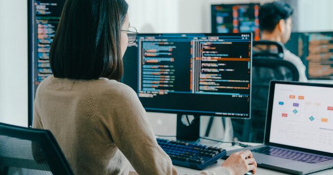 Closeup Adult Asia male, female freelance typing write prompt AI bot IT app smart program nomad, video game, terminal with coding language, user interface, designer, big data center desktop computer. - Powered by Adobe