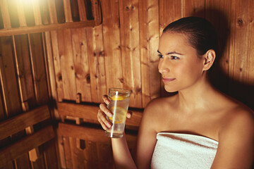 Woman, sauna and glass of water at spa for thinking in treatment, sweat or detox on vacation at luxury resort. Person, happy and relax on holiday at lodge in steam room for stress, skin or reflection