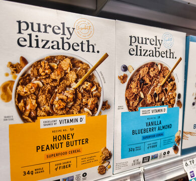 Purely Elizabeth Superfood cereal boxes on supermarket shelf with honey peanut butter and vanilla blueberry almond