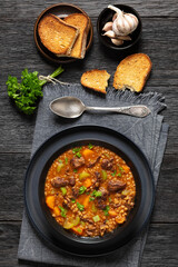 beef barley soup in a bowl, top view