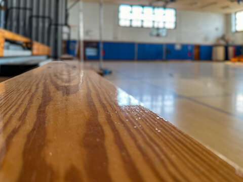 Close-up of wooden bleachers in an empty school basketball court, gymnasium.