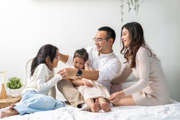 Portrait of enjoy happy love asian family father and mother holding hug cute little asian girl child smiling play and having fun moments good time, care, kid, support, insurance, child, at home