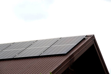 Fototapeta premium Installing a Solar Cell on a Roof.