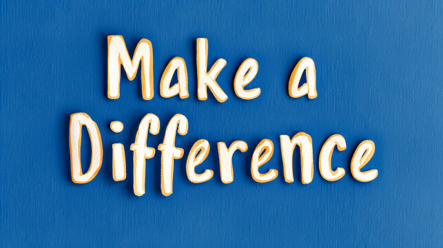Watercolor text Make a Difference isolated on a solid dark blue background 