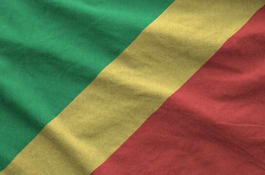 Congo flag depicted on folded wavy fabric of old cloth close up