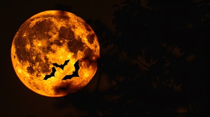 Eerie full moon with bats silhouetted
