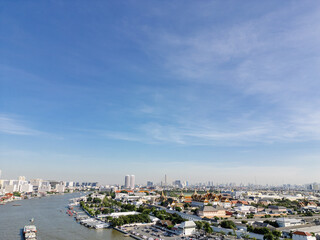 Obraz premium Aerial view Wat Arun Ratchawaram in morning with curve of chao phraya river sunset light