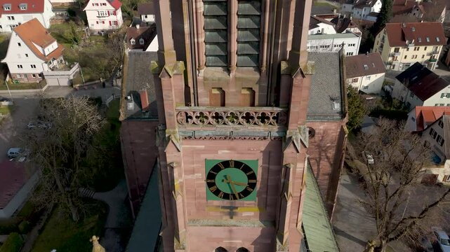 Aerial footage of Nagold church, drone flight upwards along frontal view of church tower.
