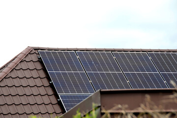 Fototapeta premium Installing a Solar Cell on a Roof.