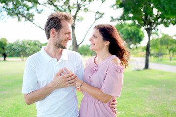 Lovely white caucasian couple relaxing at park.