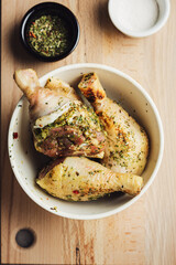 Raw chicken drumsticks with spices.