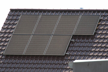 Installing a Solar Cell on a Roof.