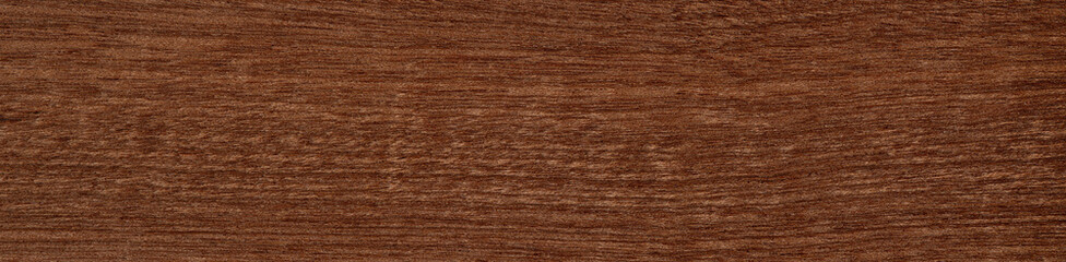 Mahogany veneer surface with a smooth finish and warm, deep brown tones
