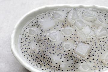 Coconut jelly with basil seeds in syrup