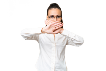 Young Arabian woman over isolated chroma key background making stop gesture with her hand to stop an act