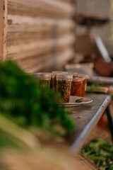 Local villager selling chilli in tubs at the vegetable market on Mauritius island.