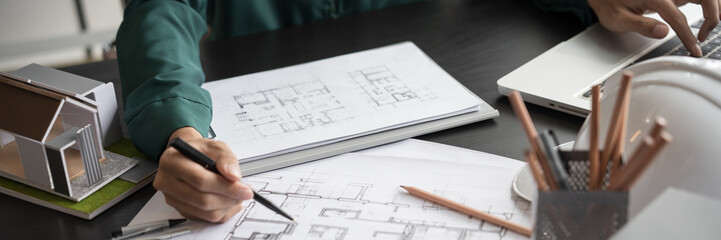 Architecture Man drawing on architectural Creative project business architecture building construction&nbsp;Industrial engineering Achievement Planning Design on eco blueprint