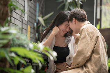 Happy Asian lesbian lgbtq couple dating in love kissing