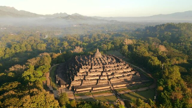 Aerial view of the majestic Borobodur Temple in Yogyakarta at sunrise, Indonesia.