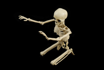 Funny skeleton  on black background.