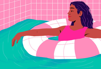 Relaxed woman floating in pool float