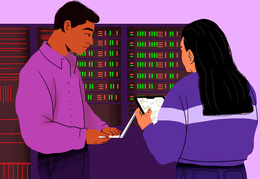 IT professionals examining data in server room