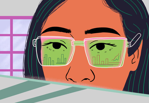 Scientist wearing eyeglasses with reflection of data graphs