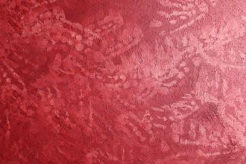 Fondo con texture materica di colore rosso cremisi, dipinta con segni casuali sulla superficie, spazio per testo