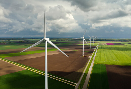 Wind turbines and agricultural fields in Flevopolder, Netherlands