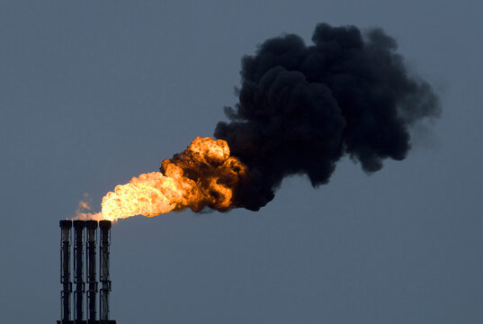 Flames releasing from chimneys of chemical plant in Netherlands