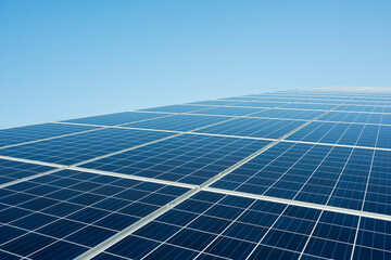 Blue solar panel at power station under clear sky on sunny day