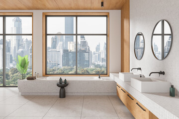 Elegant hotel bathroom interior with double sink and bathtub, panoramic window