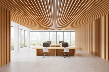 Modern office with a wooden interior featuring desks, chairs, and computers. Bright, natural light coming through large windows. Work environment concept. 3D rendering