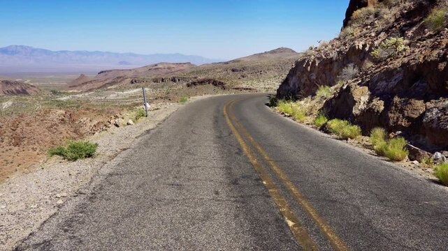Walking along historic Route 66 in the Black Mountains near Oatman, Mohave County, Arizona. 4K UHD video.