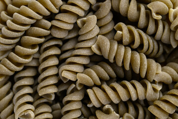 Raw fusilli pasta texture background, Food ingredient