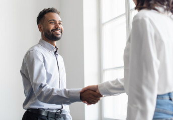 Partnership handshake in modern creative office, Businessmen shaking hands while working, Successful business, lifestyle, employment, new business, job interview, people concept