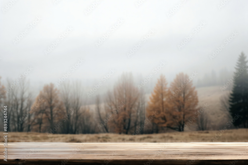 Poster Empty wooden surface providing space for displaying products against a backdrop of a misty autumnal forest