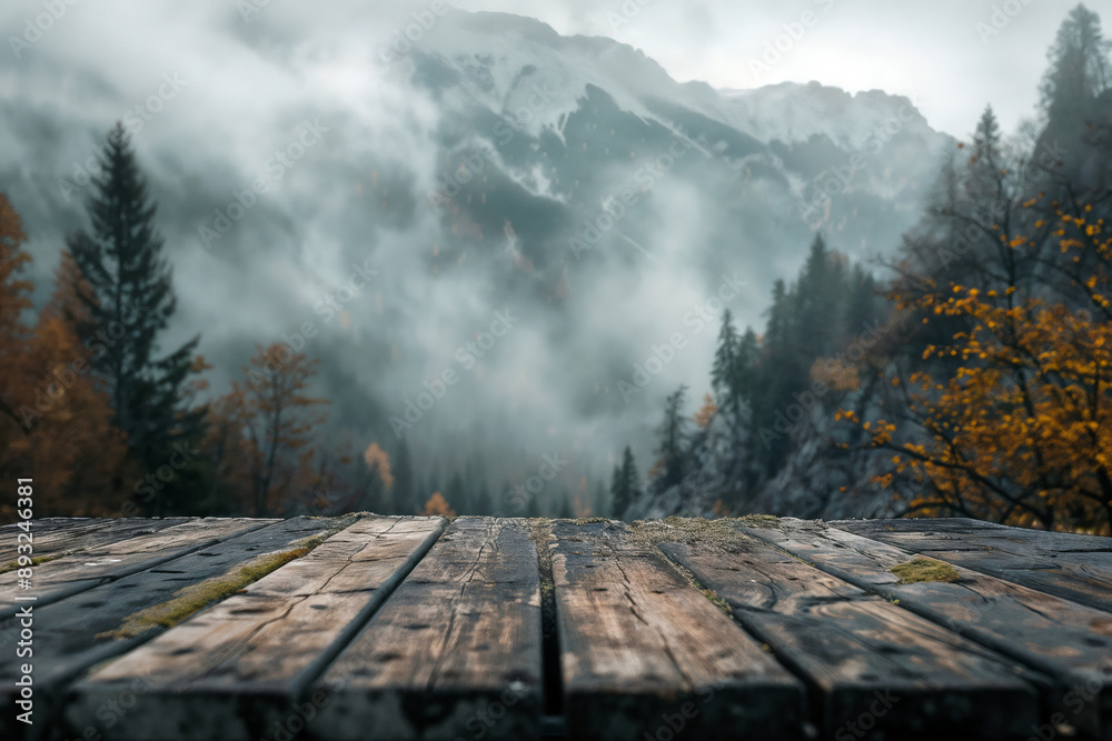 Wall mural Empty wooden tabletop providing a place to showcase your product against a backdrop of a misty mountain valley in autumn