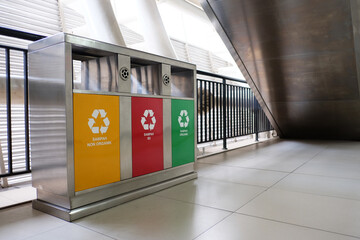 Stainless steel dust bins provided in LRT station area, with instructions based on categories: non organic (yellow), hazardous and toxic (red) and organic (green). 