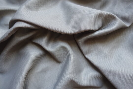 unprinted grey polyamide fabric in soft folds