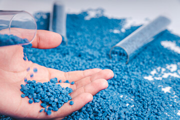 Blue plastic grain, plastic polymer granules,hand hold Polymer pellets, Raw materials for making water pipes, Plastics from petrochemicals and compound extrusion, resin from plant polyethylene.