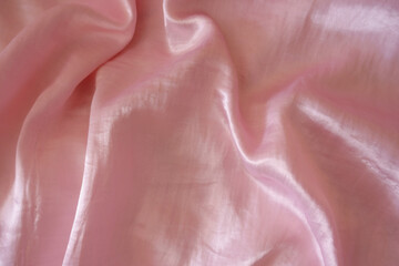 Jammed light pink satin polyester fabric