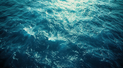 Obraz premium Oceanic Majesty: Deep, turquoise waves ripple and shimmer, capturing the vastness and power of the sea. 