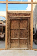 A handcrafted wooden door. The door was made with the kundekari technique.