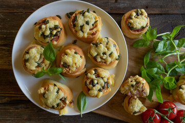 Hearty filled yeast rolls with ham, cheese and pumpkin seeds. Delicious party food or snack