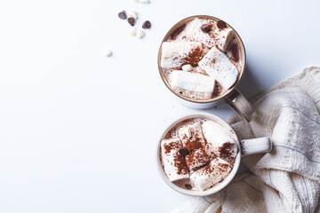 Winter hot chocolate with marshmallows in mug on white background. Christmas drink concept.