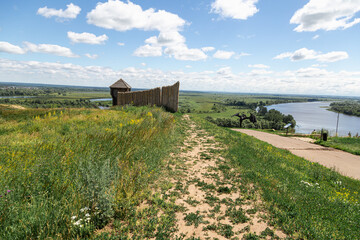 Obraz premium Ancient wooden fortress on a background of river spaces. Russia, Tatarstan, ancient Bulgar fortress in Yelabuga